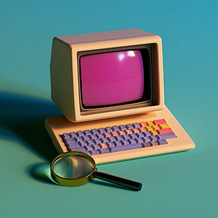 magnifying glass next to a computer representing WordPress SEO